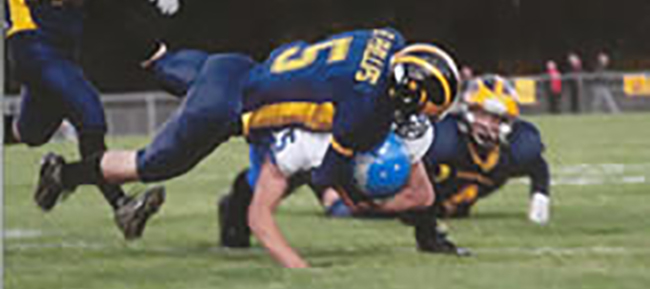 o_1b2tnudei1s01opt174c1sori437.jpg A football tackle